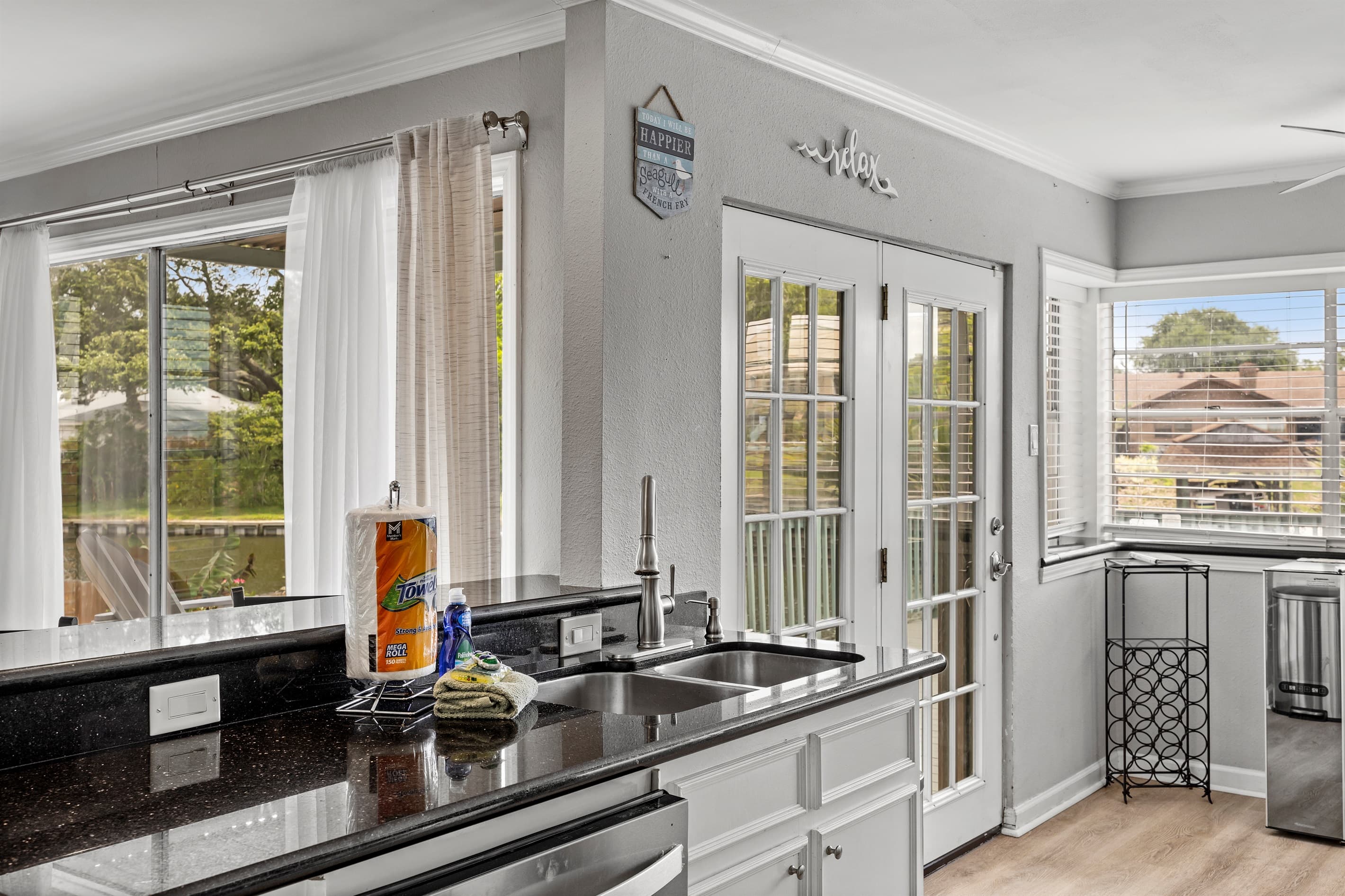 Coastal kitchen at Lakeview Landing — natural yard views and beach-inspired details make every meal feel like a true Galveston getaway.