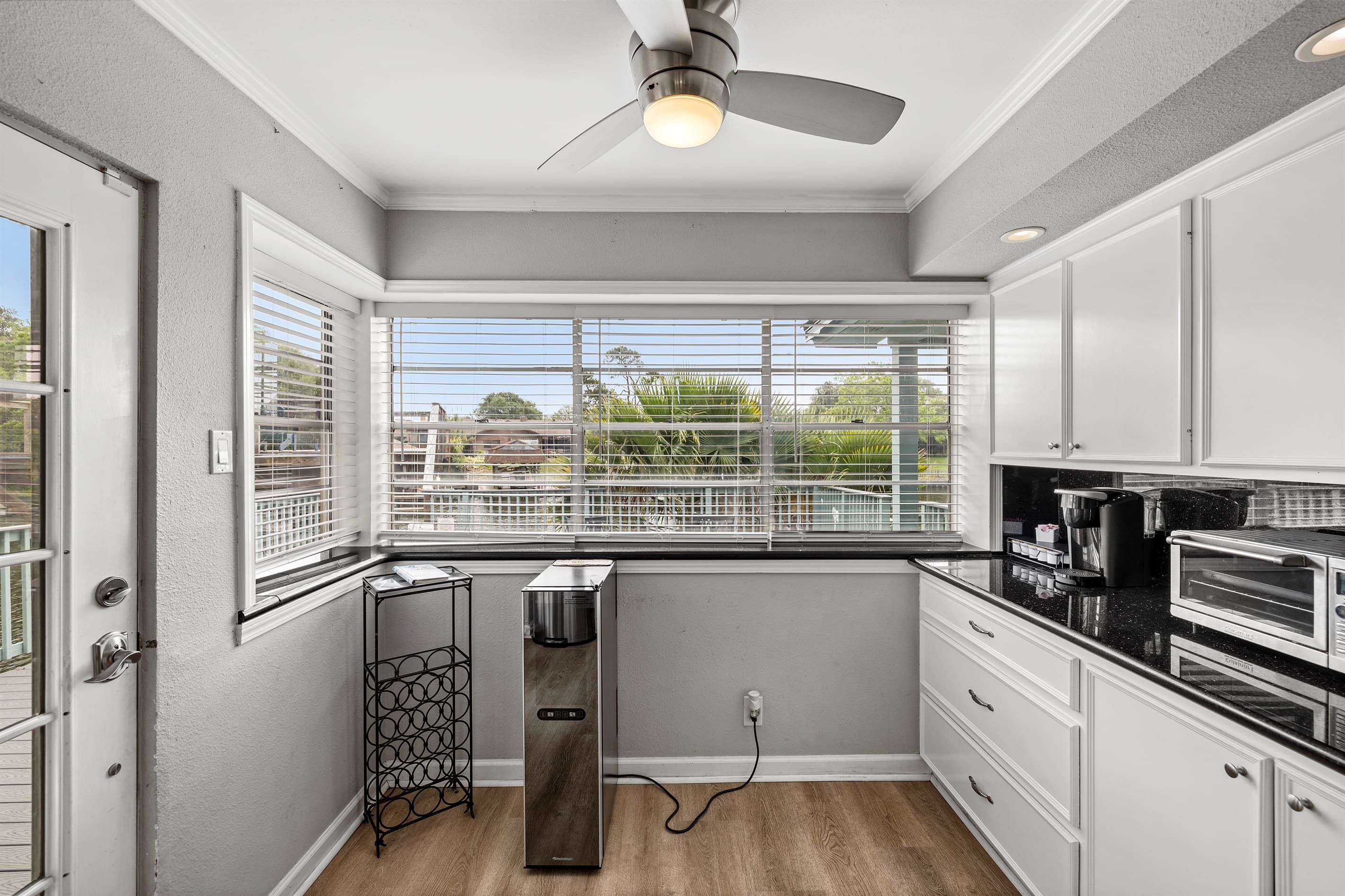 Functional and bright kitchen at Lakeview Landing — natural light, outdoor views, and everything you need for a great Galveston stay.