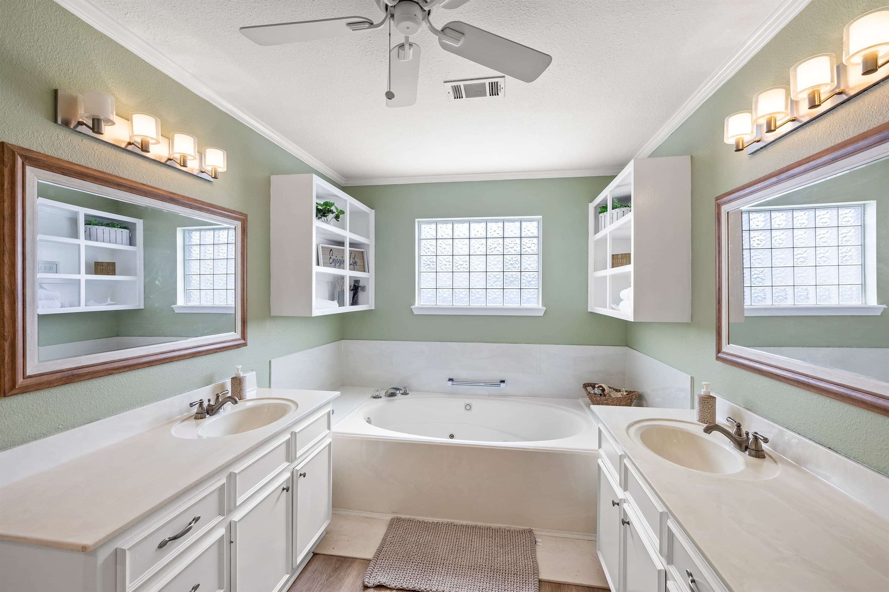 Master en-suite at Lakeview Landing — jetted soaking tub, dual vanity, and premium finishes for a true spa retreat after a day on Madeline Lake.