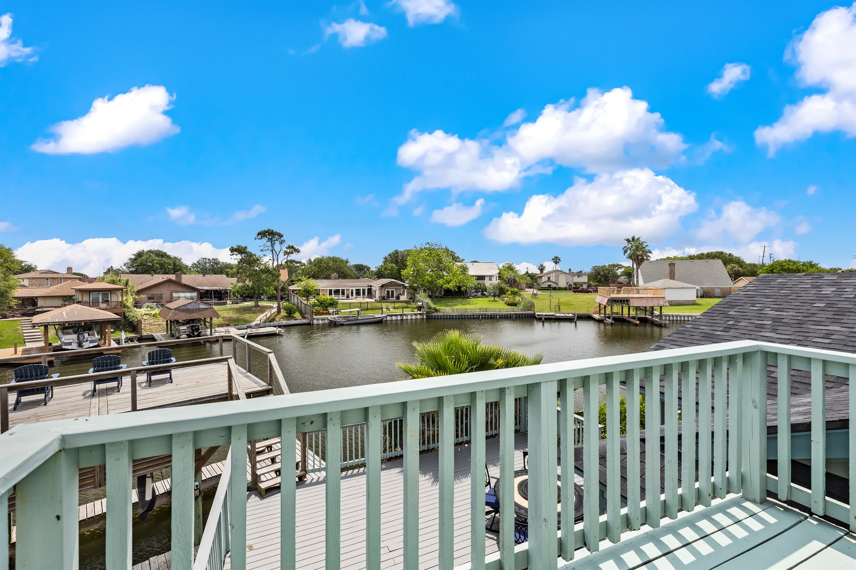 Private balcony off Bedroom 2 at Lakeview Landing — step outside from your upstairs bedroom to breathtaking views of Madeline Lake and the Galveston waterway.