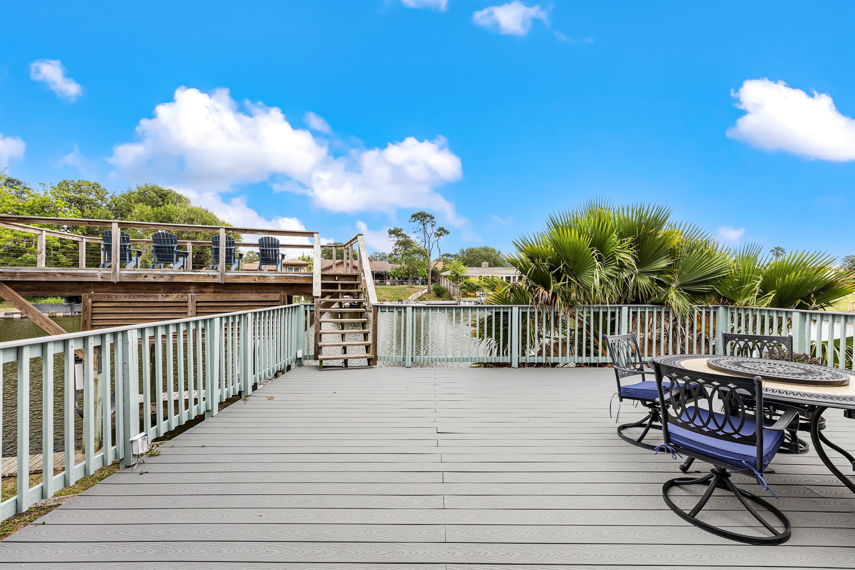 Expansive multi-level deck at Lakeview Landing — generous space for the whole group to spread out and enjoy the Galveston waterfront air.