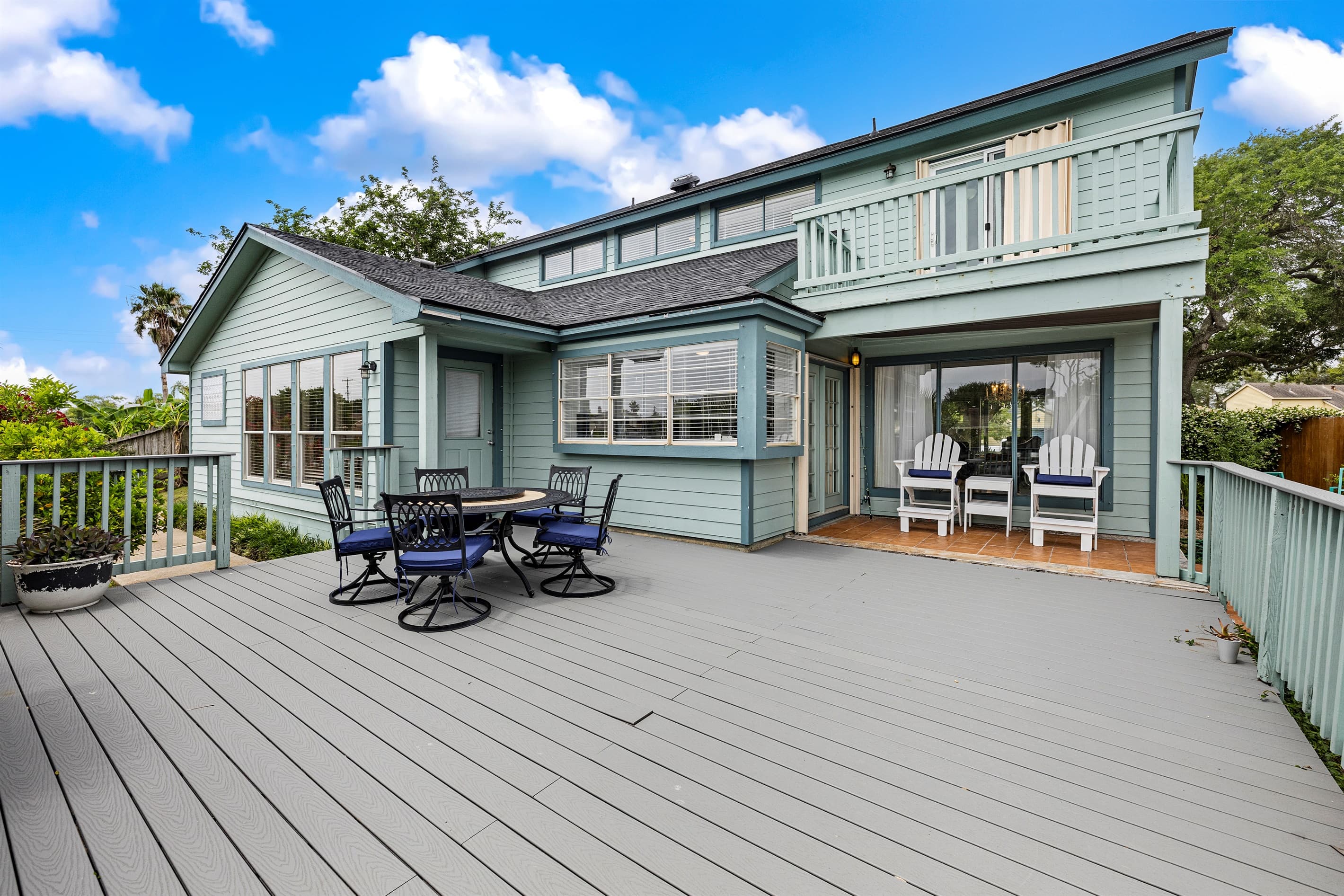 The full multi-level deck at Lakeview Landing — outdoor dining, lounge space, and waterfront access all from this stunning Galveston home.