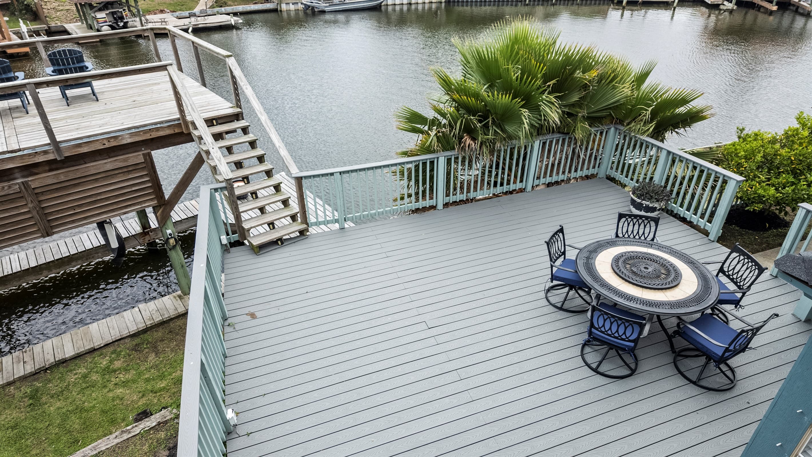 Multi-level deck at Lakeview Landing — each level offers its own outdoor living space, all with views of Madeline Lake and the Galveston waterway.