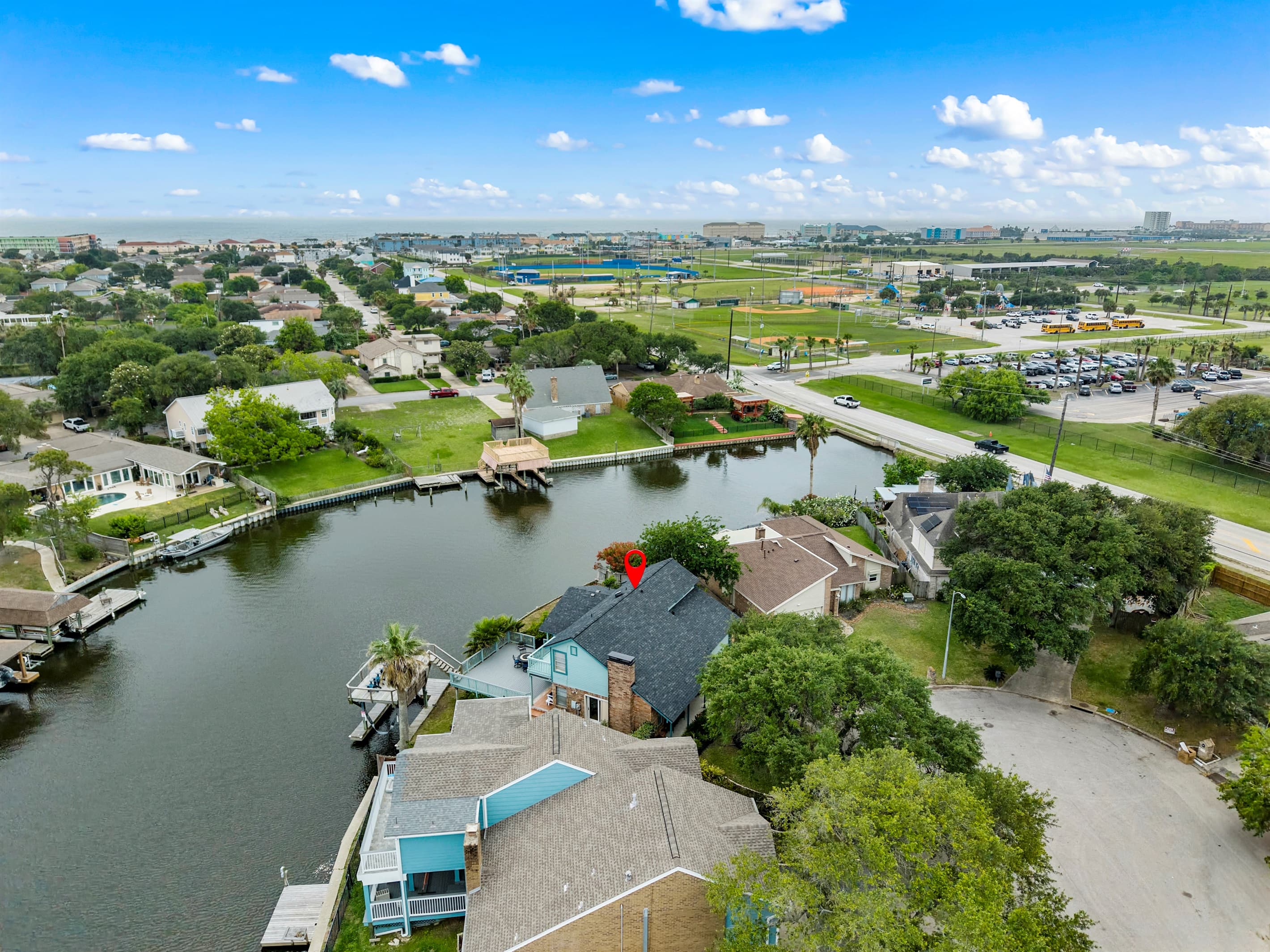 Bird's-eye view of Lakeview Landing's waterfront neighborhood — Madeline Lake winds through one of Galveston's most sought-after lake communities.