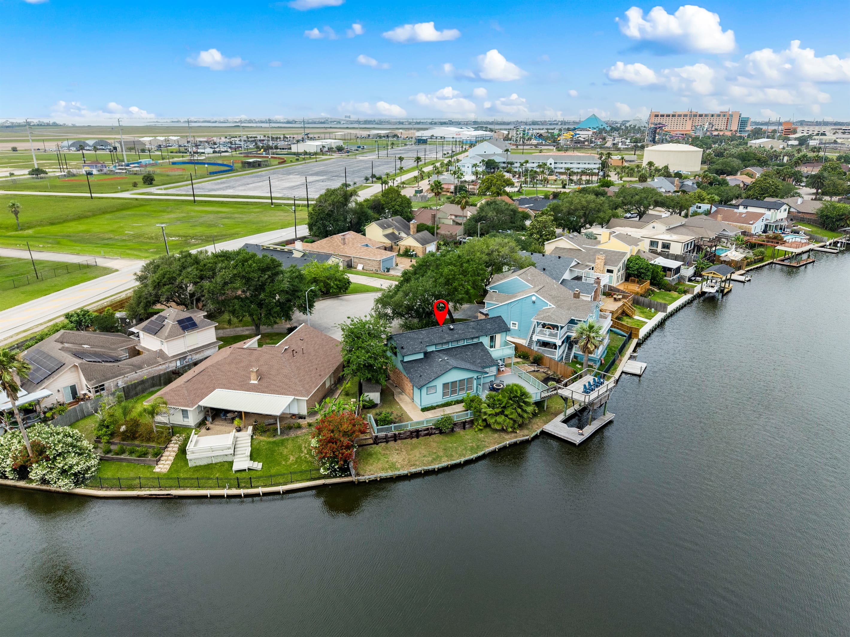 Lakeview Landing's waterfront position on Madeline Lake — aerial view showing the private dock and Galveston waterway community.
