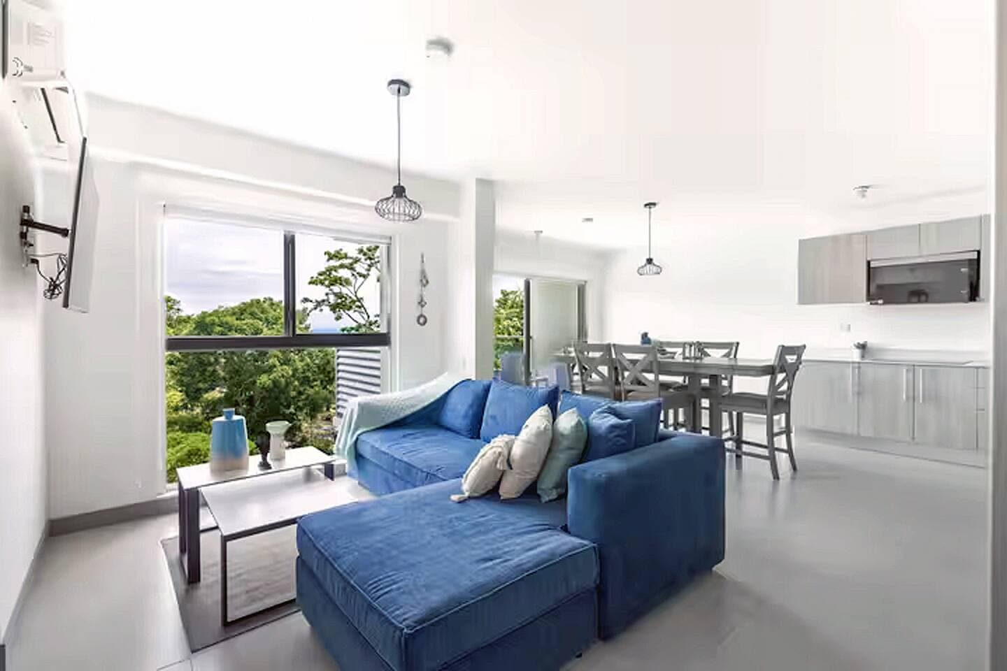 More spacious Originally a 3-bedroom apartment, we opened the third room to create a larger living area, allowing space for a high dining bar table and a spectacular social area.