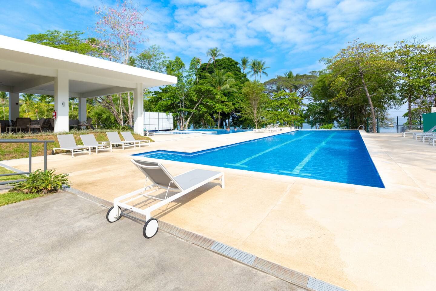 Take a dip and keep an eye out—monkeys and red macaws are often spotted in the trees around the pool.