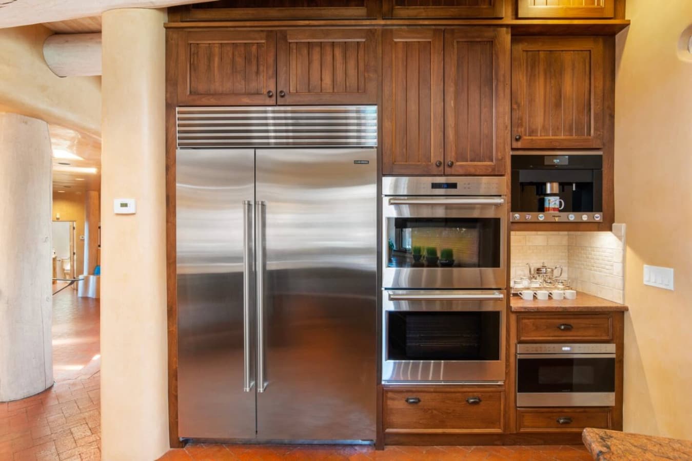 Sub Zero Refrigerator, Wolf Double Ovens, Miele Coffee Maker, Microwave