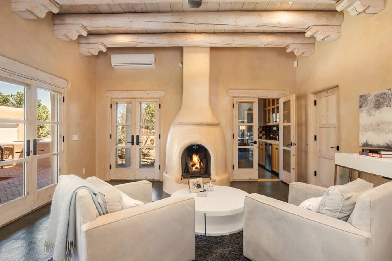 Master bedroom Sitting Area with Northeast Courtyard - wood burning fireplace