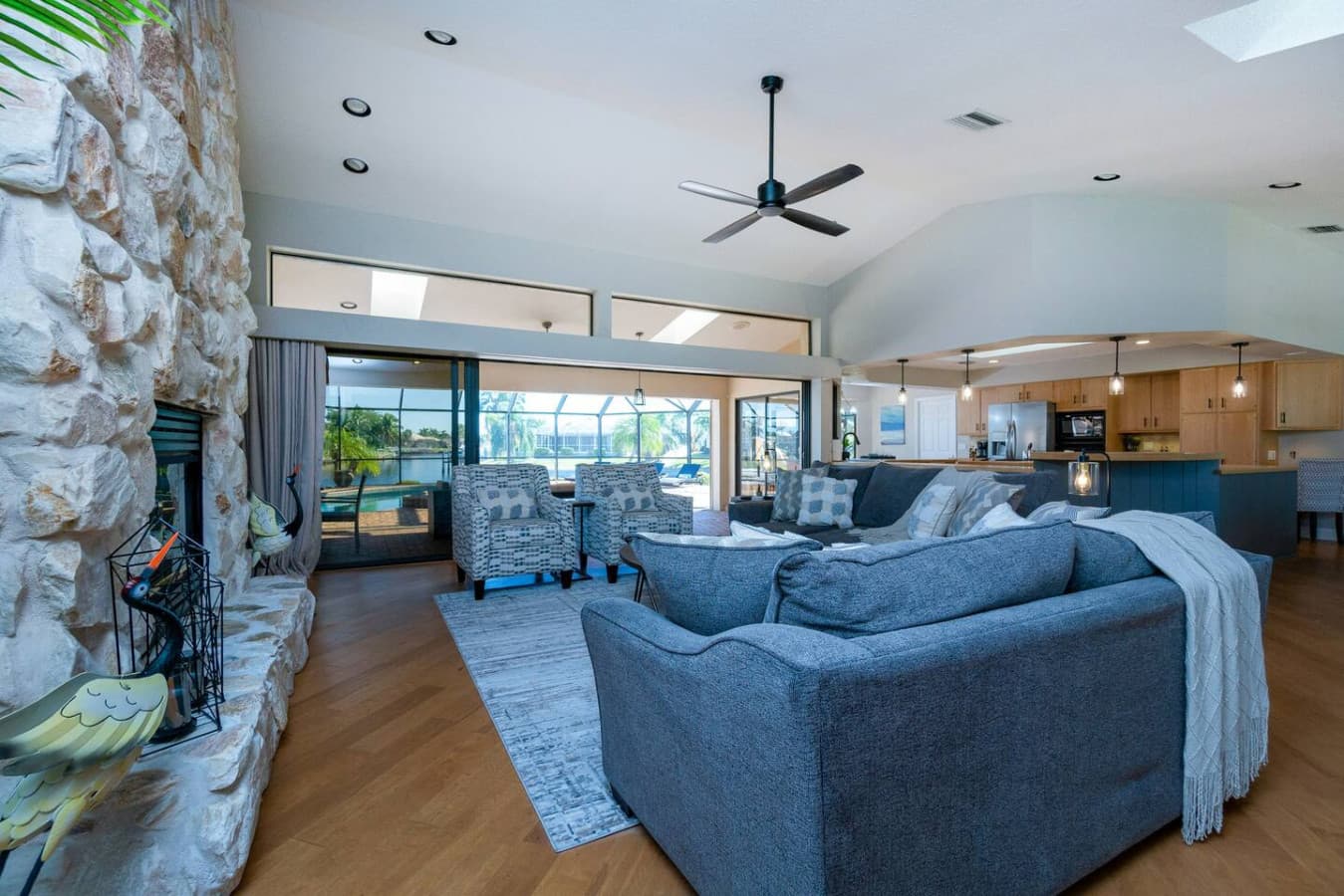 Great Room/Open Concept Kitchen/Outdoor Living Space view from Stereo Cabinet/Hallway Area