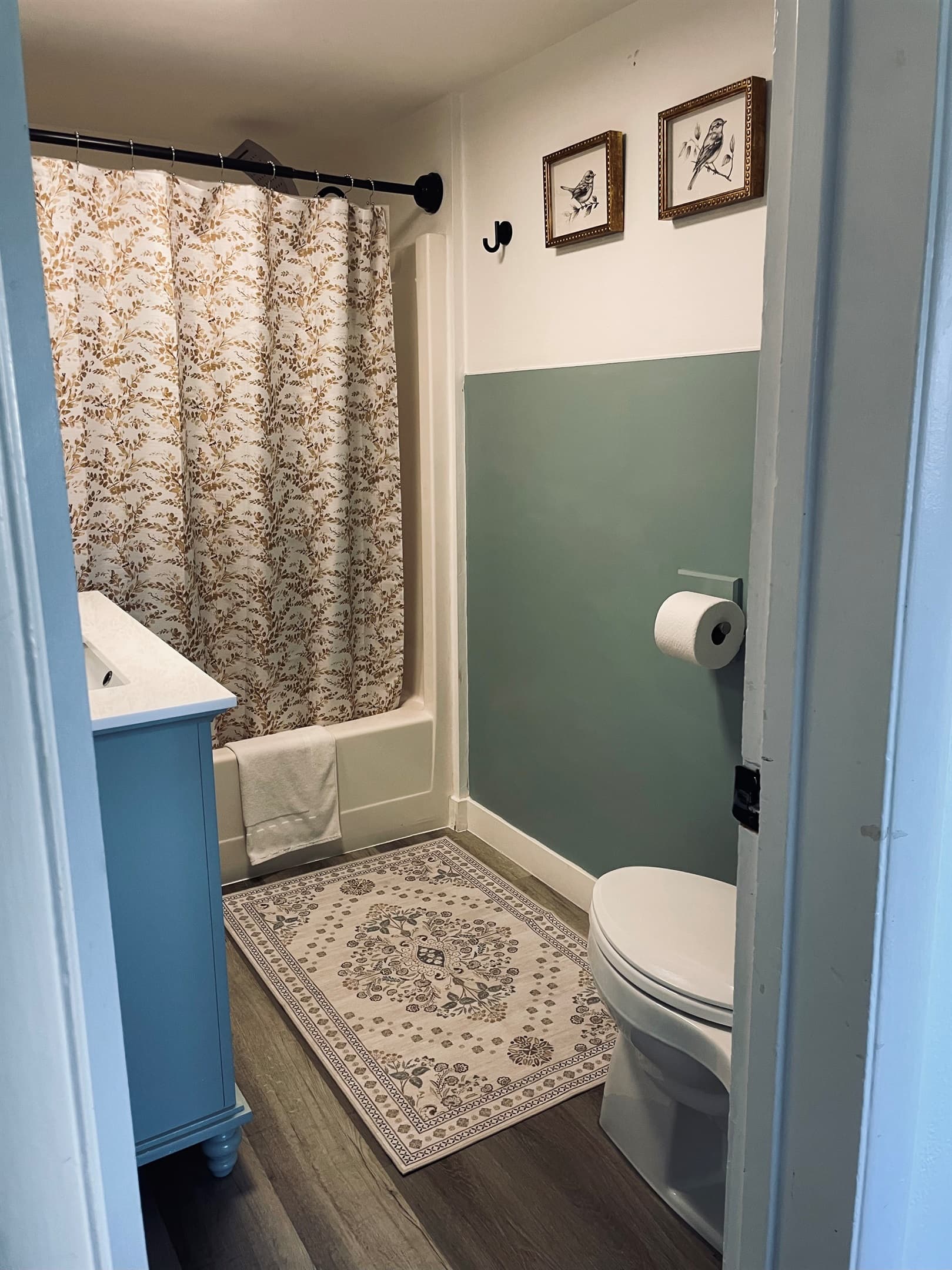 A bright bathroom with a full tub and shower combo, designed for comfort and everyday ease.