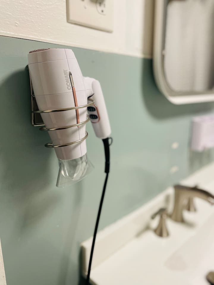 A hair dryer is thoughtfully provided, adding convenience and ease to your morning routine.