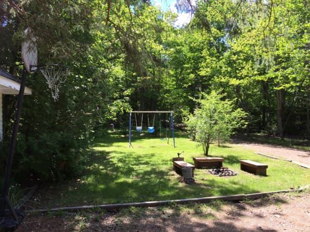 Front Lawn with Swing set & Firepit