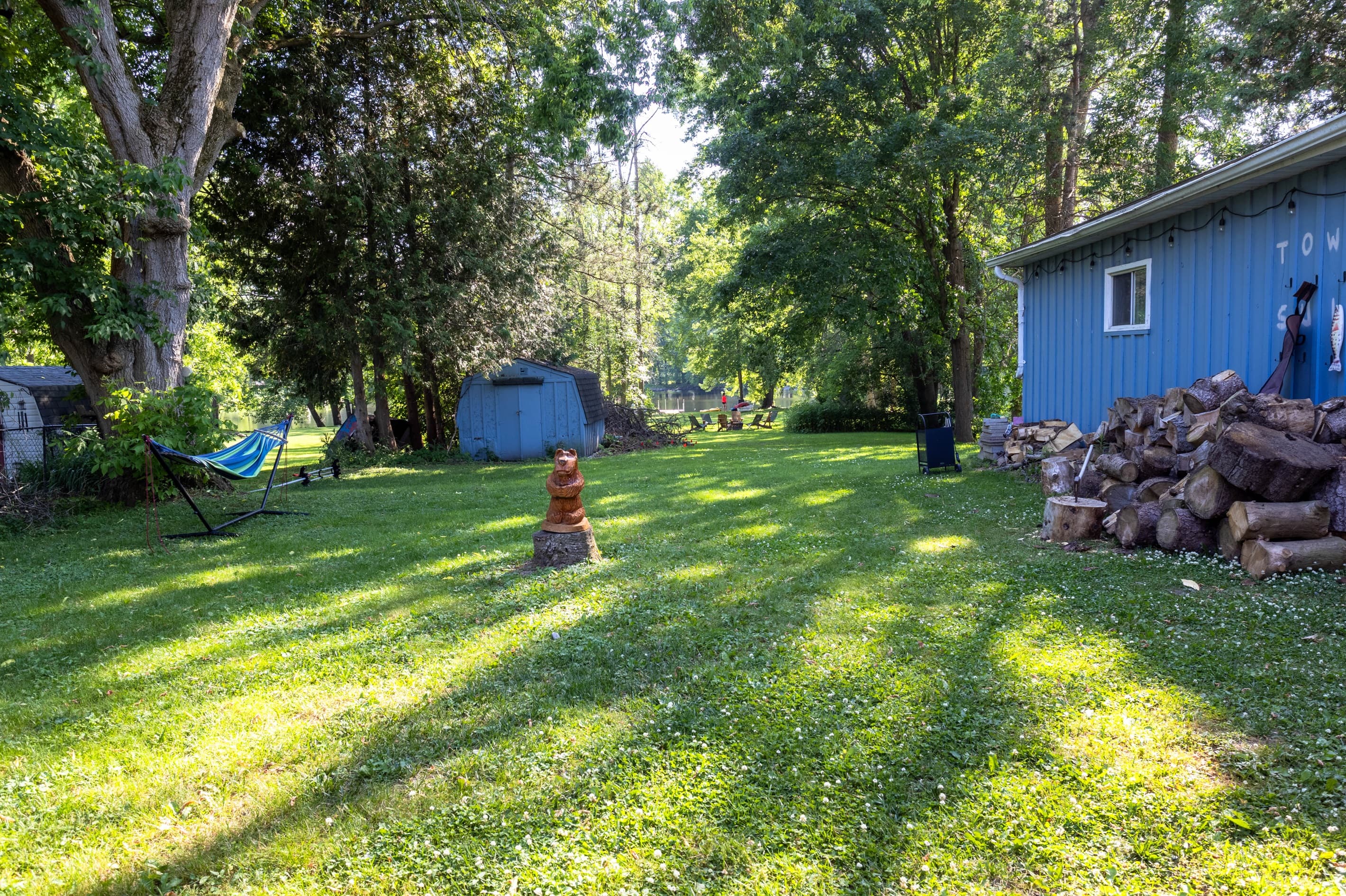 A large, open yard filled with green space, perfect for quiet moments or lively fun.