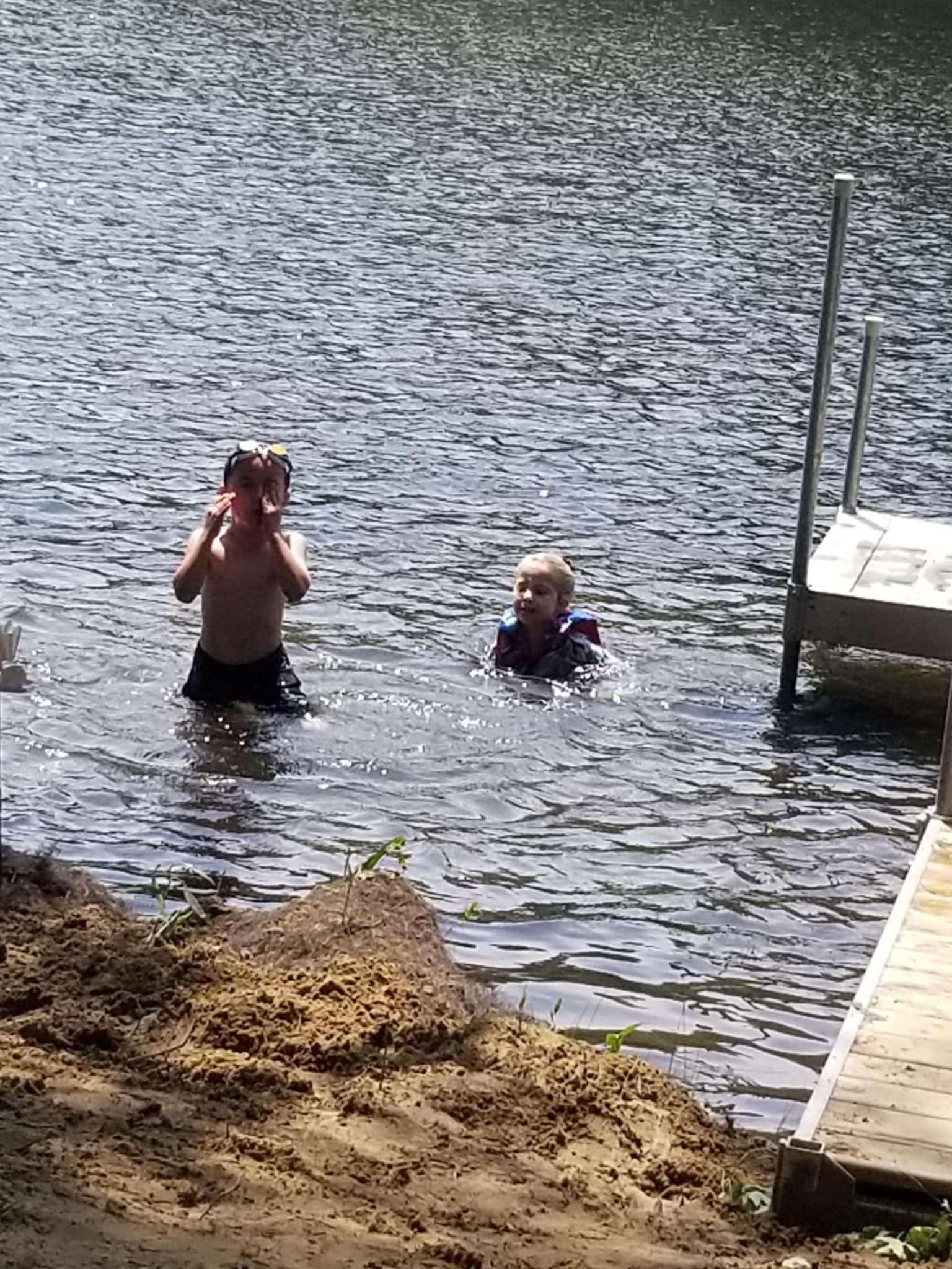 Kids love the shallow, weed-free water around the dock. Gentle shoreline makes wading, swimming, and floating safe and fun while parents relax nearby. Life jackets provided.