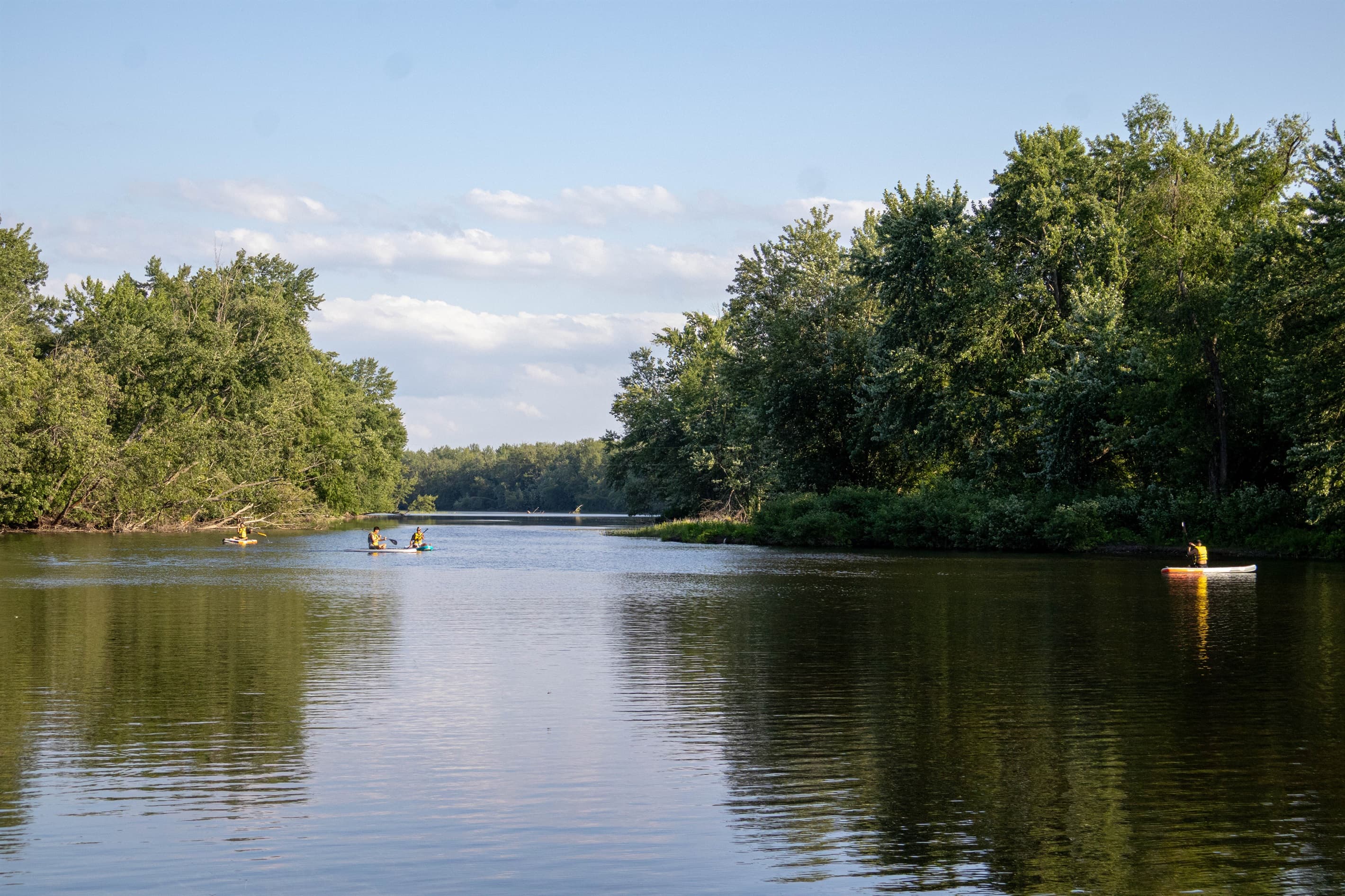 Standing on the Dock. Simple river moments: a kayak, a fishing line, and still water.