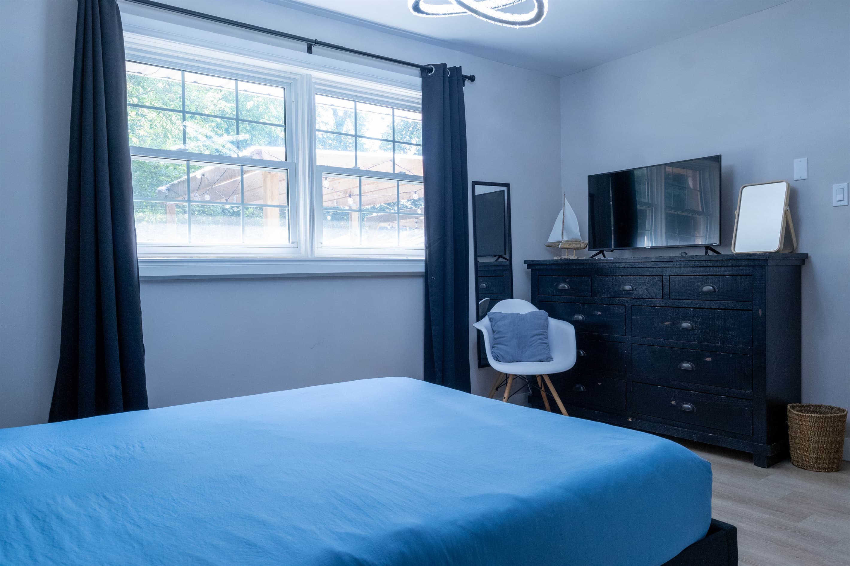 Bedroom 2: your quiet retreat with TV, dresser, closet, chair, USB lamps, electric fireplace and 2 plush robes for cozy nights in or a trip to the hot tub.