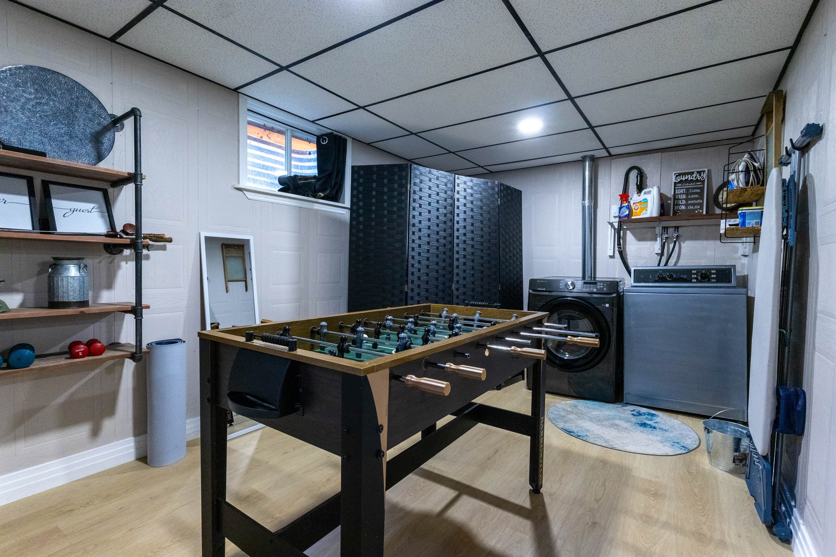 A touch of convenience and wellness: laundry room, yoga mats, and light weights for those who like to move.