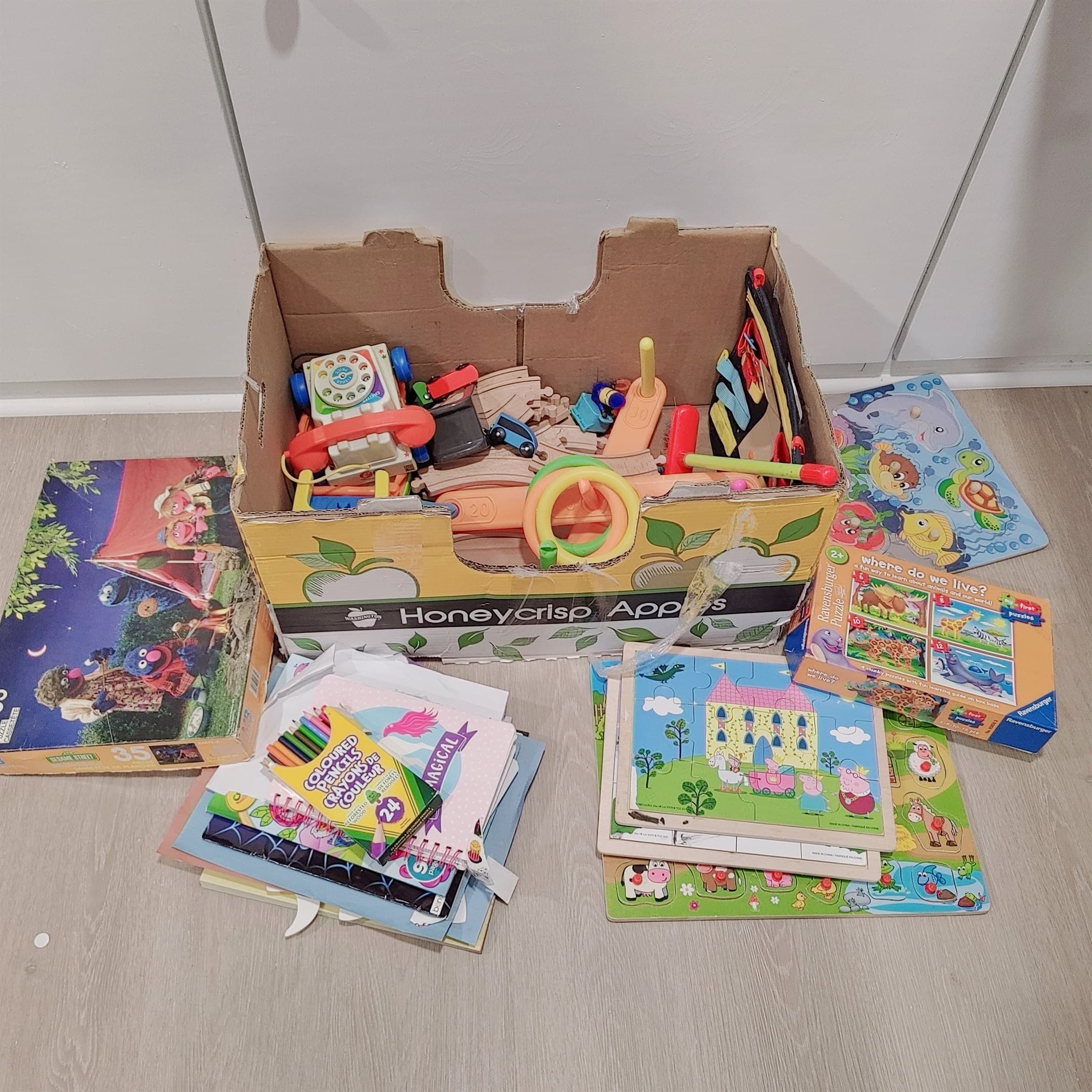 A small, thoughtful selection of puzzles, colouring supplies, games, and toys—just enough for little ones to enjoy.