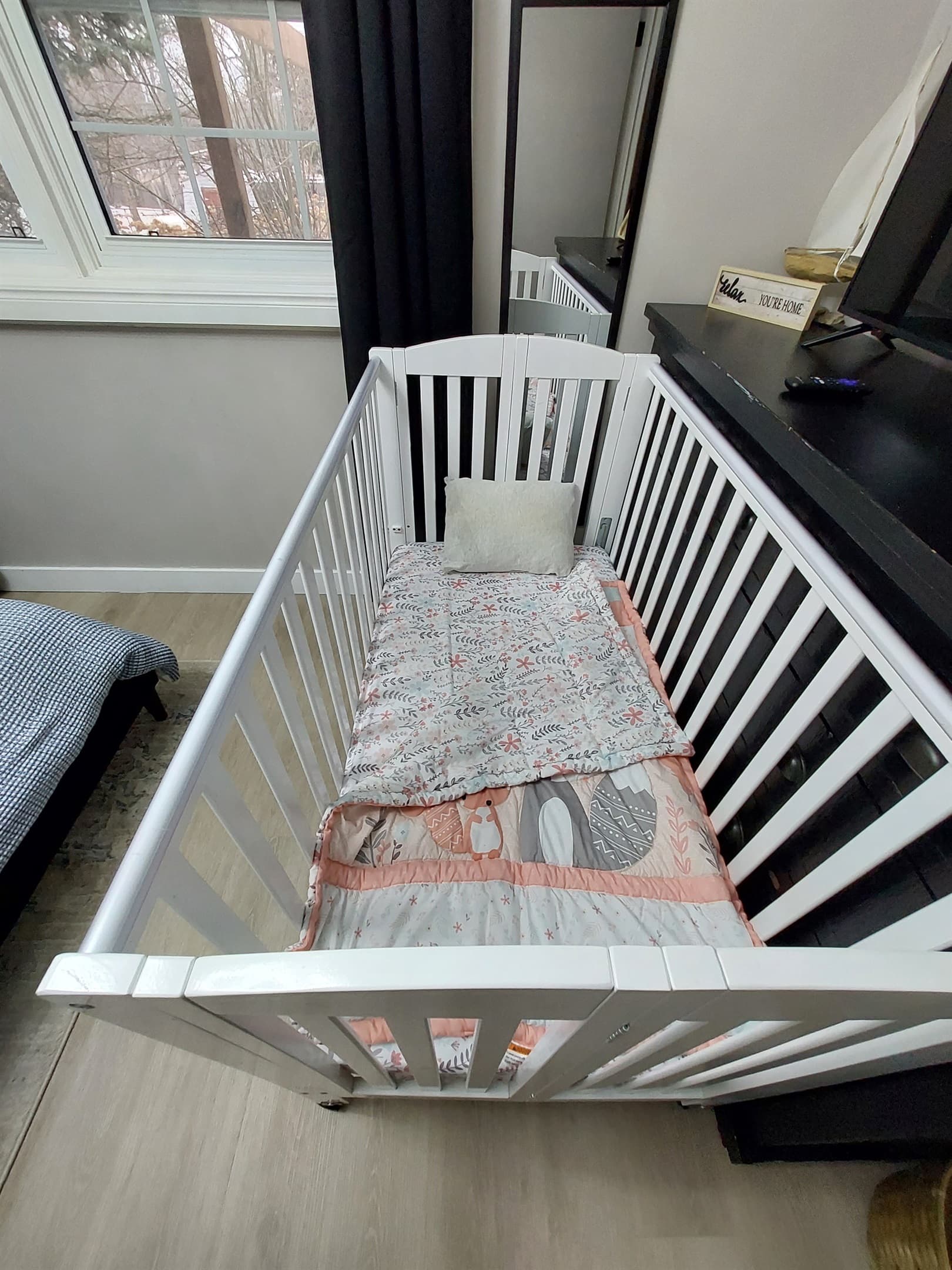 Full size crib with adjustable height can fit in any room. It is folded into a closet and can be requested to be set up if needed.
