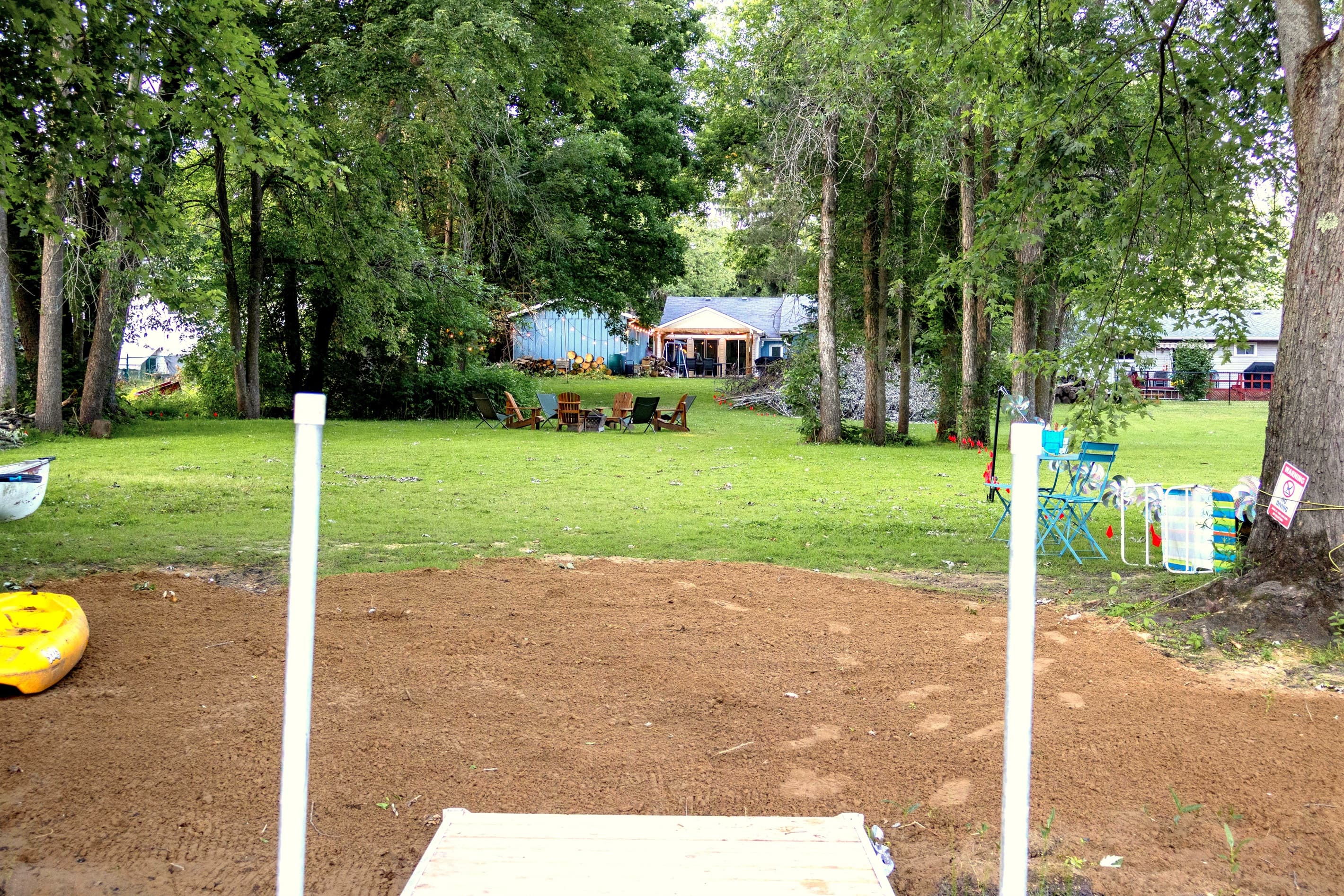 Beach, lots of green space and Adirondack chairs ready for stories by the fire. Cottage in the background — this is what summer evenings are made of. Just add family.
