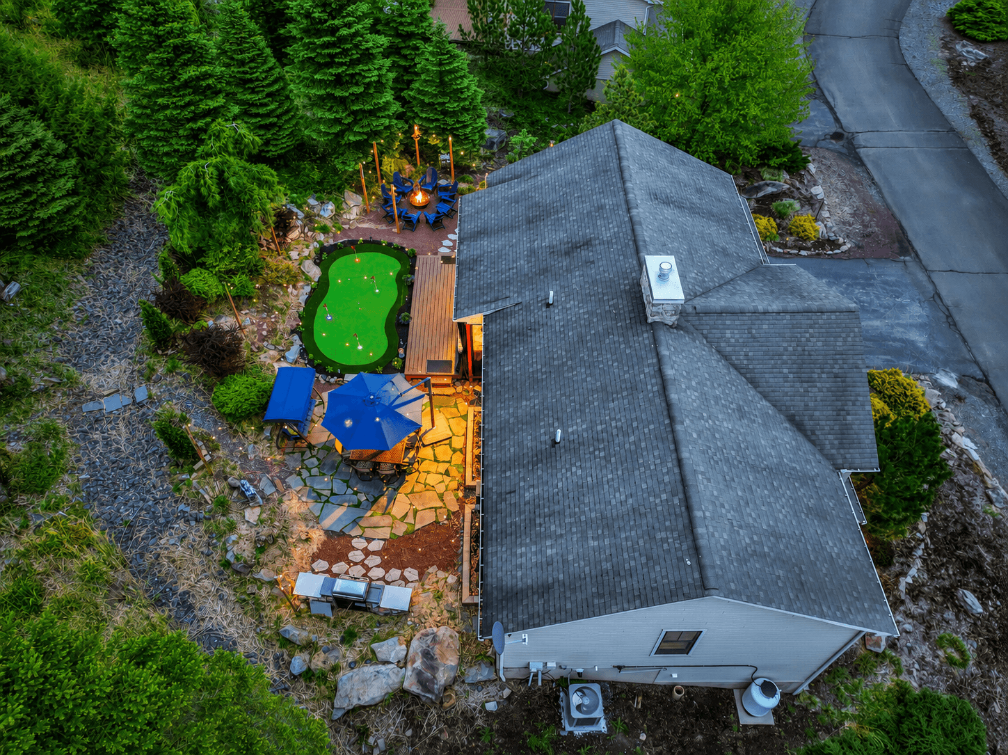Watch the fire glow, line up a few putts, and settle into vacation mode. From above, you can see why guests never want to leave this private backyard retreat. Every corner of this outdoor oasis was designed for connection and relaxation.