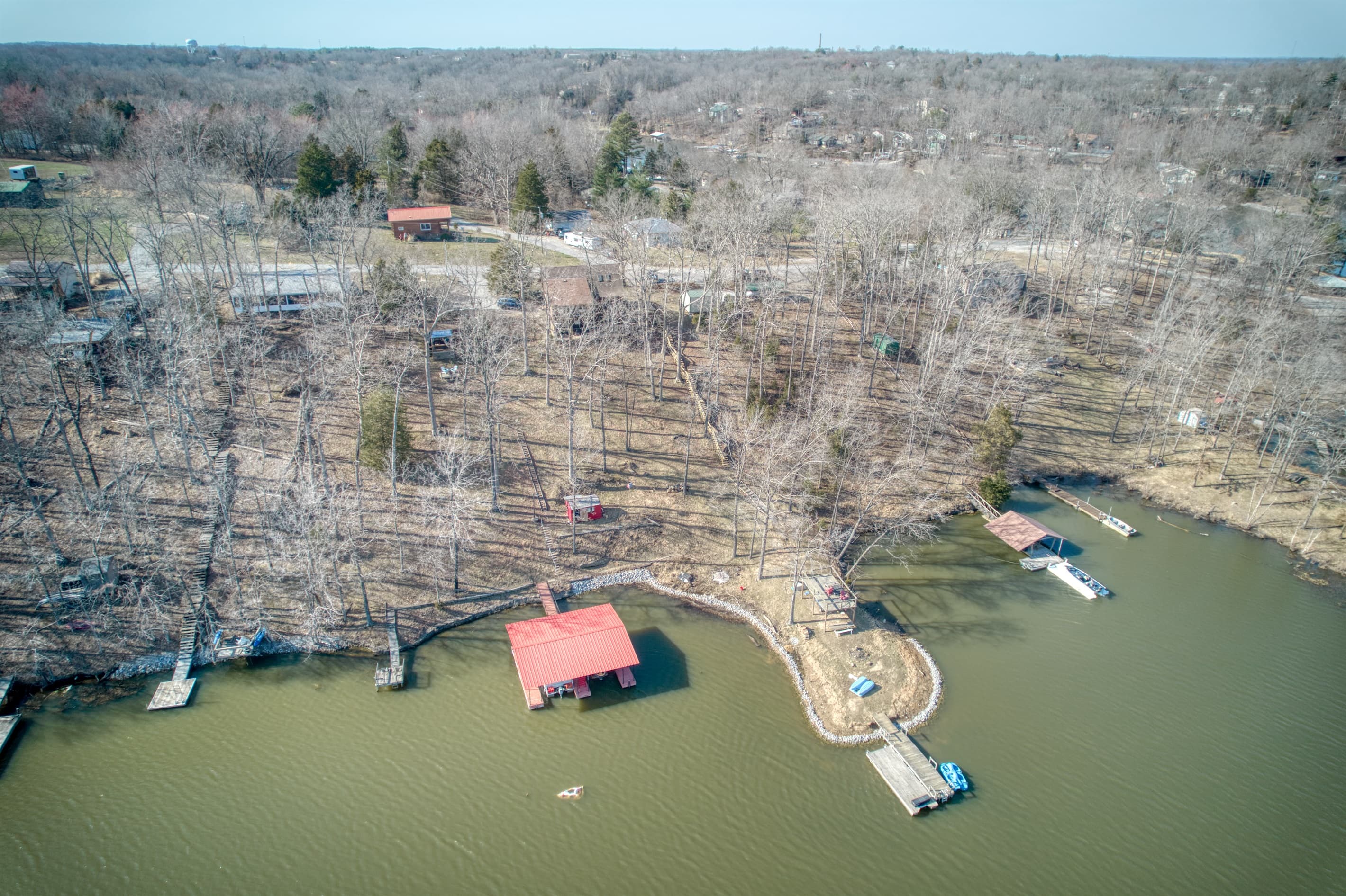 Aerial Red Roof Cabin to lake