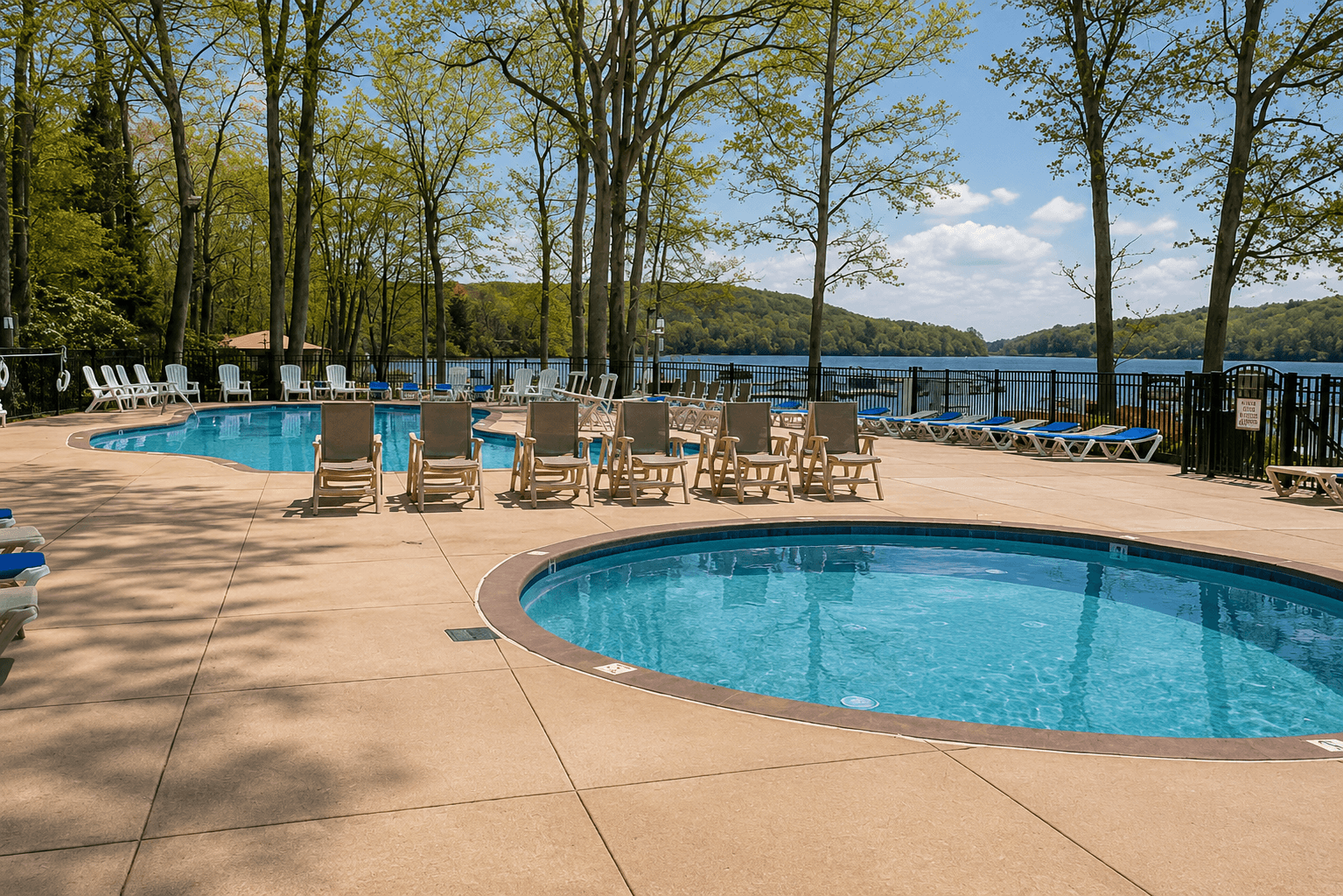 Dive into Fun at Our Private Big Boulder Community Pool! Picture your family frolicking in two refreshing pools, complete with a playful kid's area, all set against the serene backdrop of Big Boulder Lake.