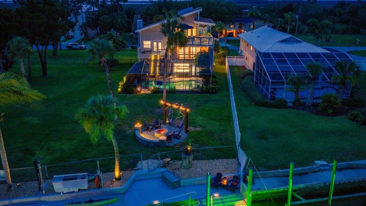 Private waterfront retreat with a heated saltwater pool, fire pit lounge, 45’ dock, and direct Gulf access—all just minutes from open water.