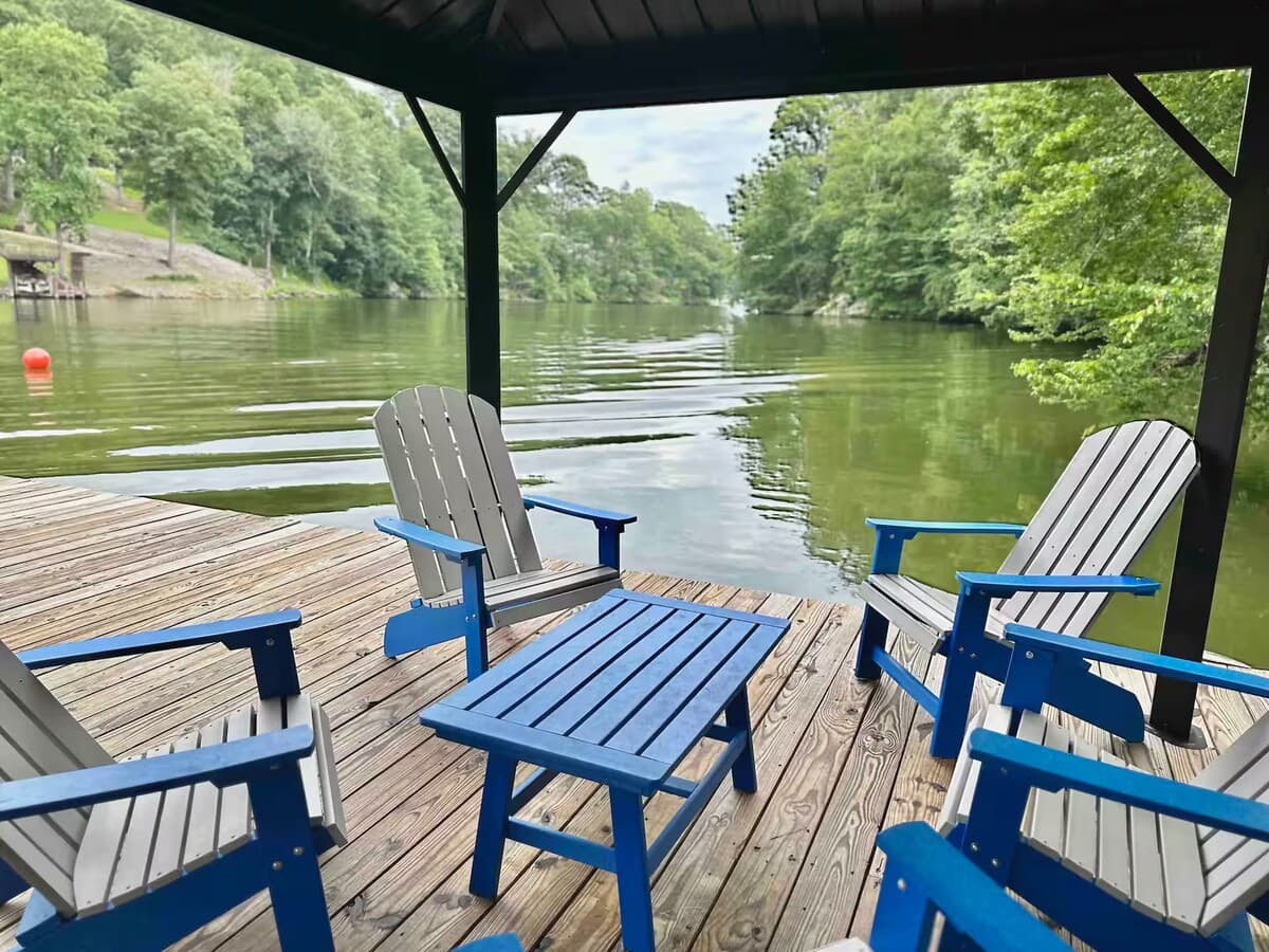 Shaded comfort under the covered pergola — 4 lakeside chairs on the private dock.

covered pergola, private dock, secluded cove, lakeside seating, deep crystal-clear water, swimming, shaded dock, Smith Mountain Lake.