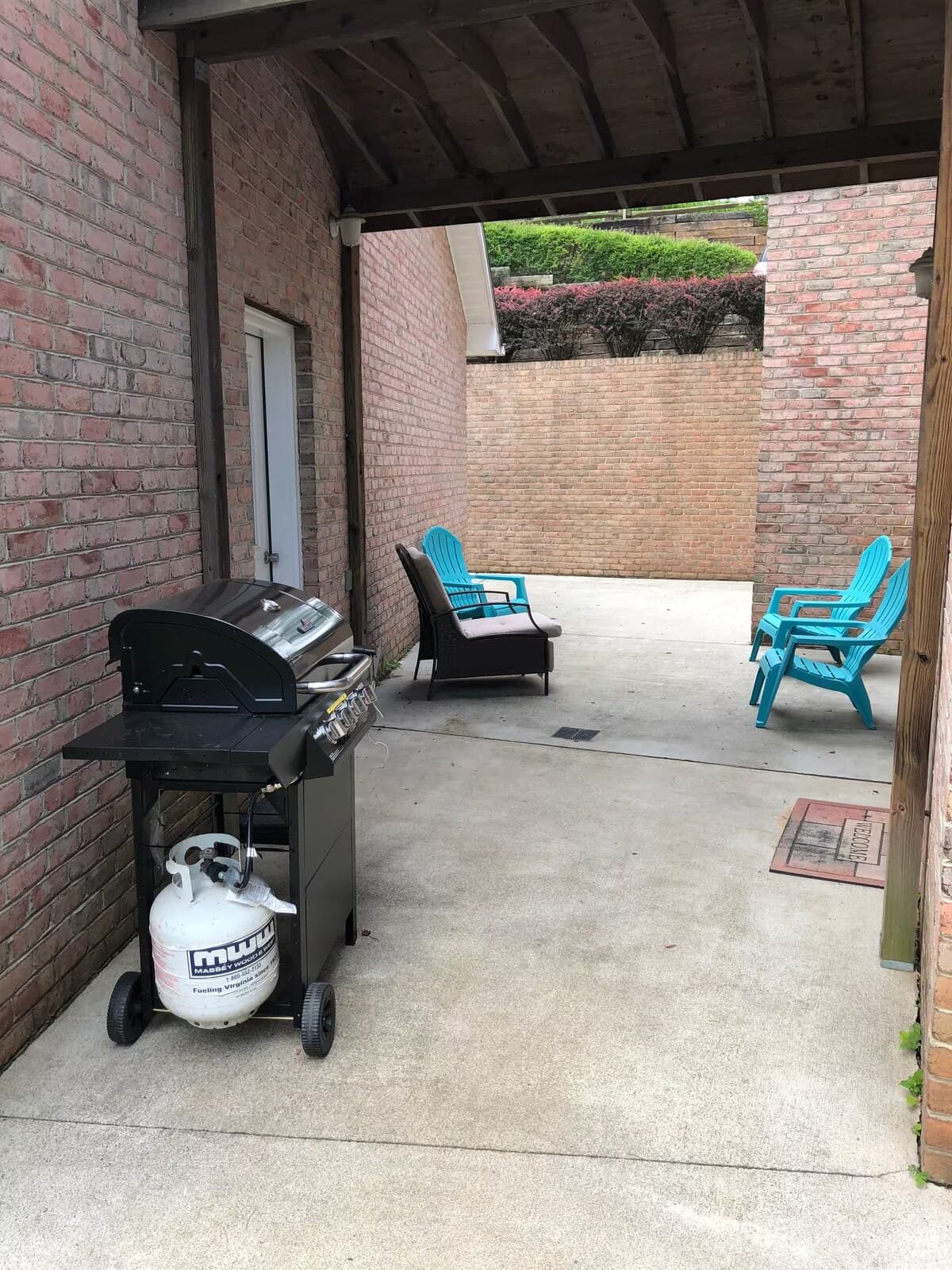 Covered propane grill station with patio seating — rain-or-shine grilling.

propane grill, covered grill area, outdoor kitchen, BBQ, grilling station, patio seating, all-weather grill, Smith Mountain Lake rental.