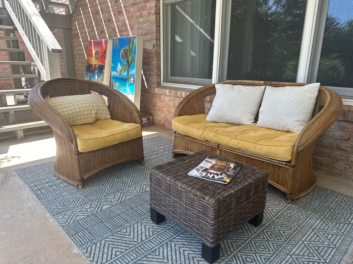 Downstairs patio wicker seating — coffee-with-a-lake-breeze spot.

Wicker patio seating, covered patio, outdoor lounge, morning coffee spot, lake breeze, lower-level patio, cozy outdoor seating.