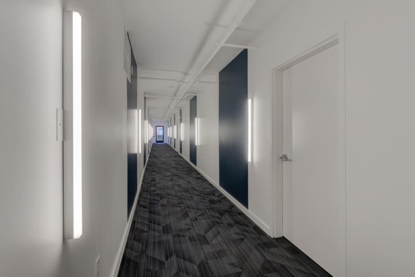 A well-lit hallway to your apartment.