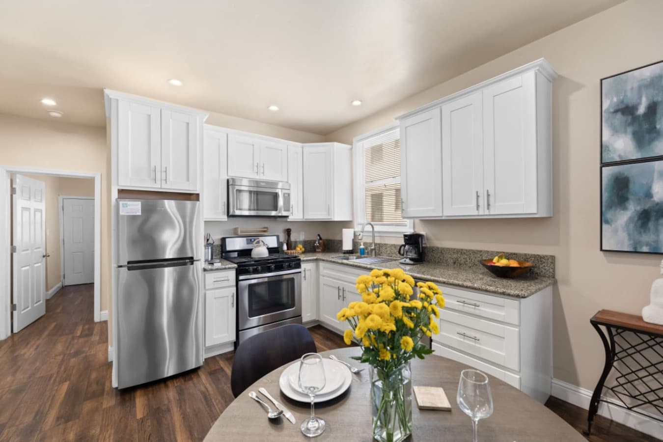 Bright, open kitchen ready for breakfast, dinner, or snacks.