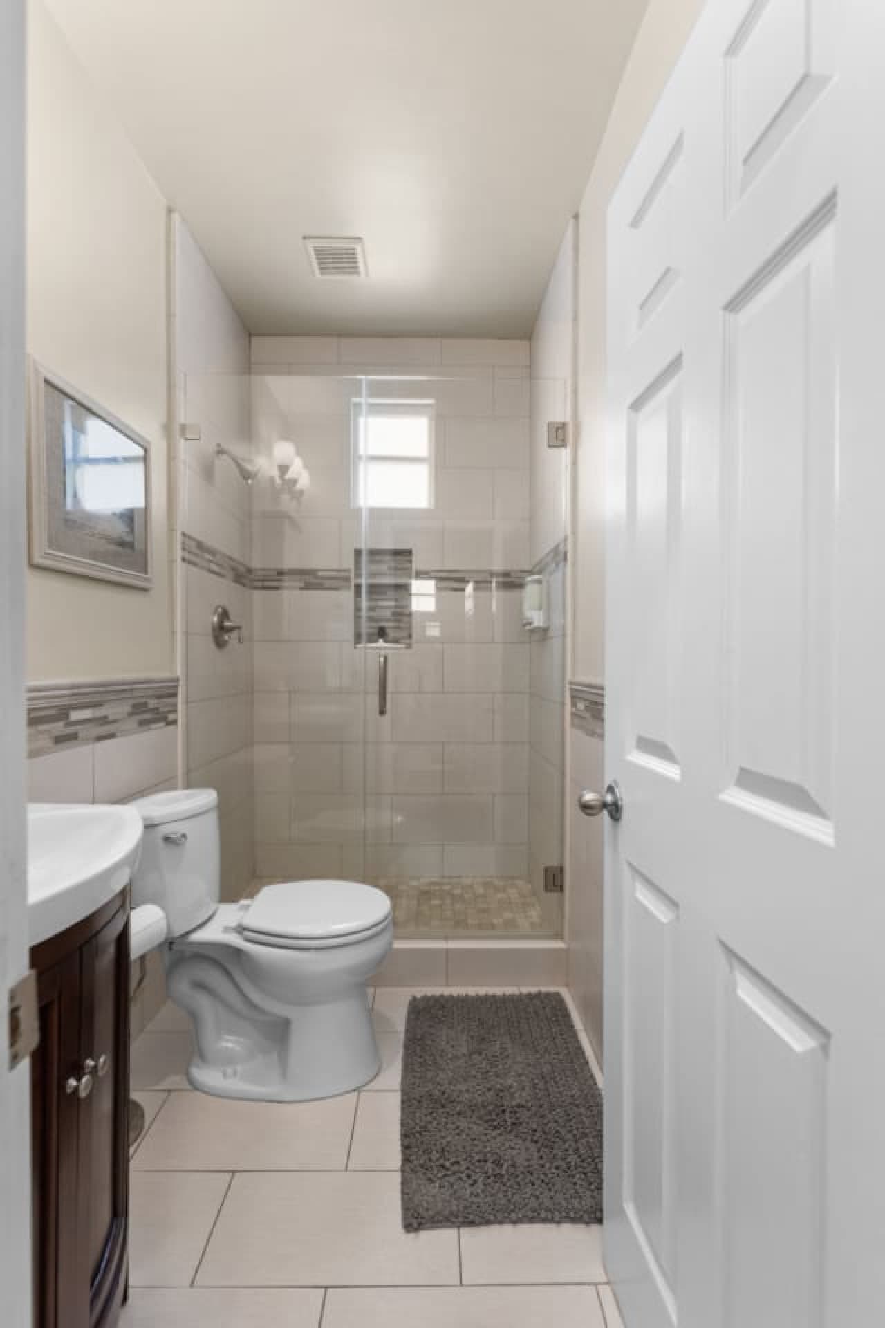 Relax and recharge in a spacious, high-ceiling shower.