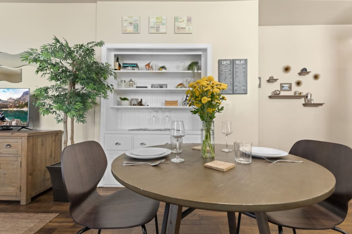 Charming dining nook for two in the heart of the open-concept space.