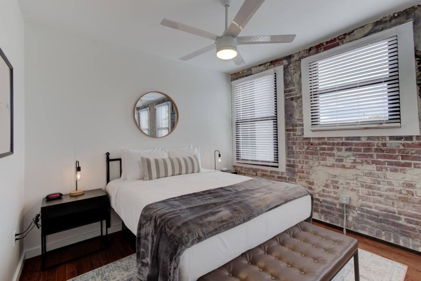 Cozy and bright queen bedroom with plush linens and ample storage, offering a peaceful retreat in the heart of Memphis.