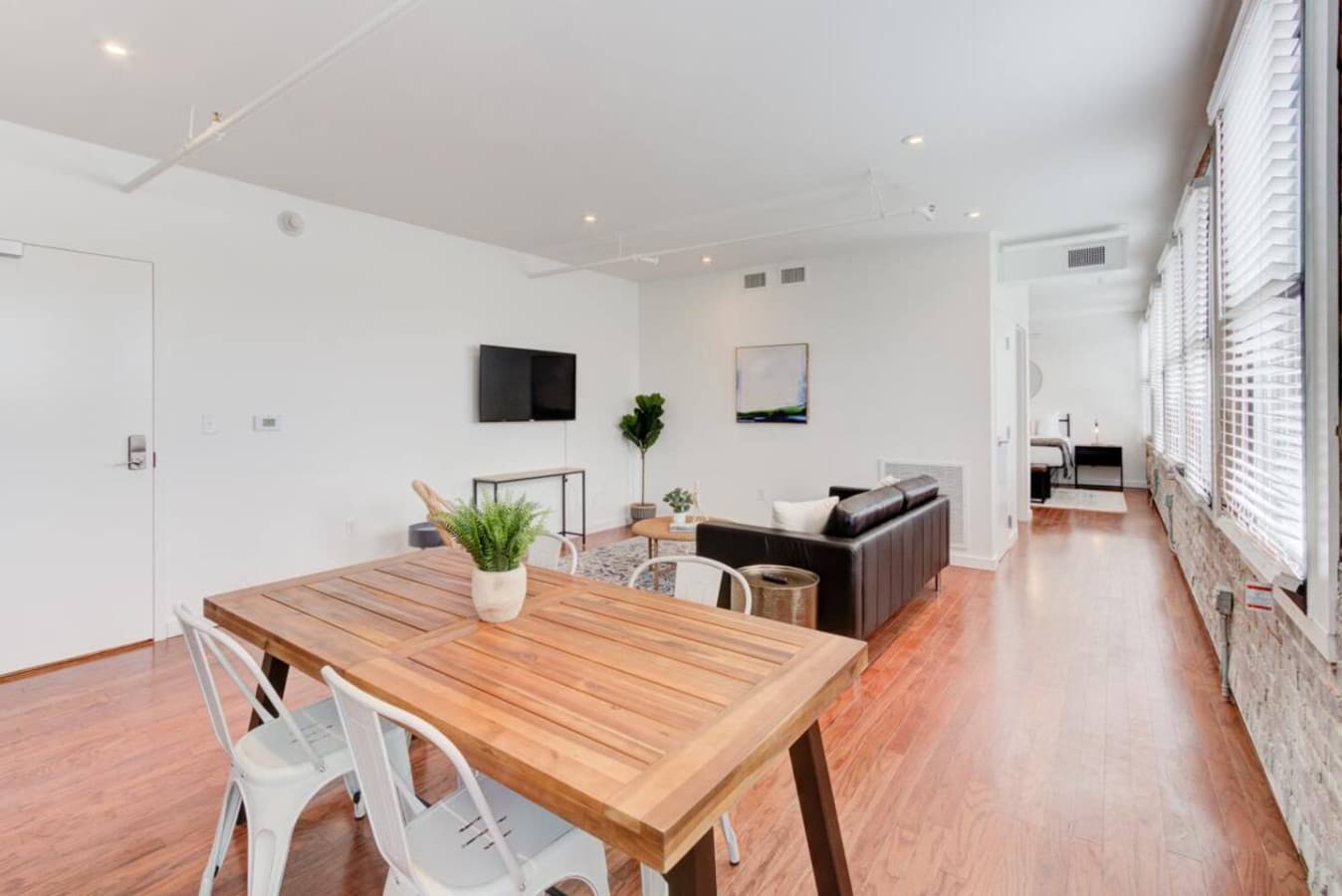 Inviting dining area, perfect for meals or casual work, seamlessly connected to the living space.