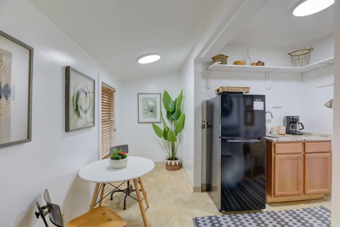 But wait, there's more! Studio dining, kitchen space, another massive fridge, and yes—more coffee.