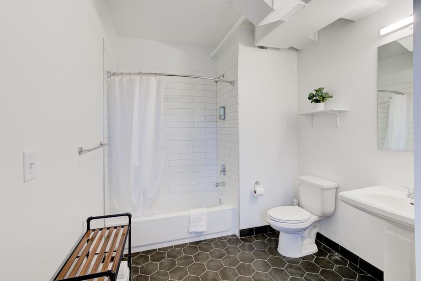 Full-size bathroom with tub- you will have all the essentials you’ll need for your stay- rub-a-dub-dub from soap, shampoo, and plenty of fresh, clean white towels.