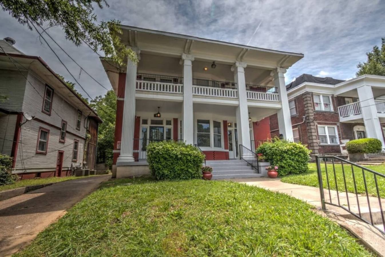 view from front of property *use narrow driveway to the left to access the private parking in back*