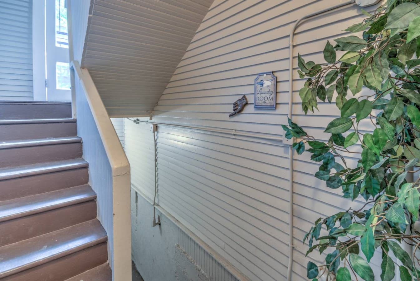 stairs in the rear of the building will lead you down to the shared laundry room you have full access to
