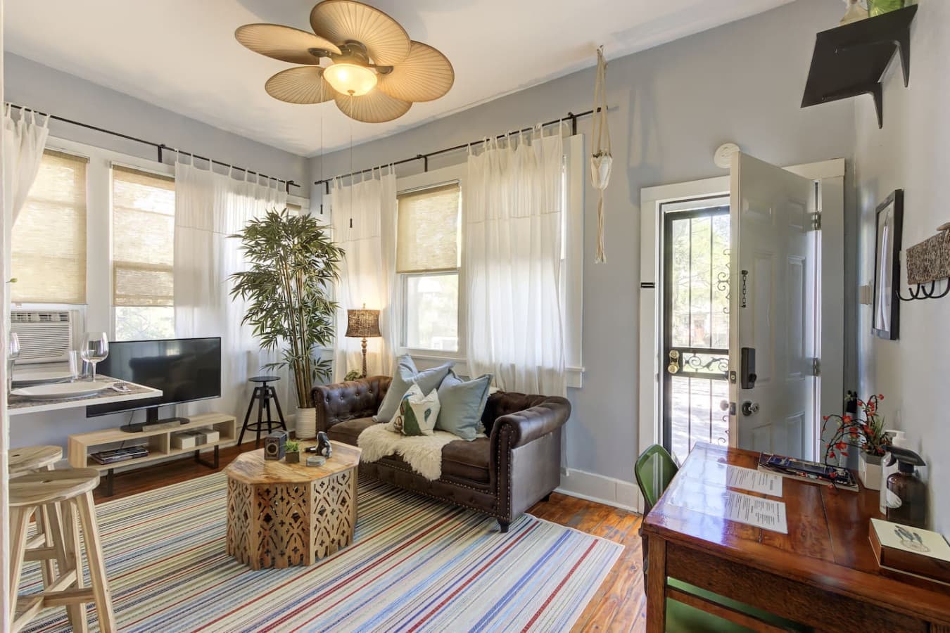 Step through the front door and you’re greeted by soft sunlight filtering through sheer curtains.