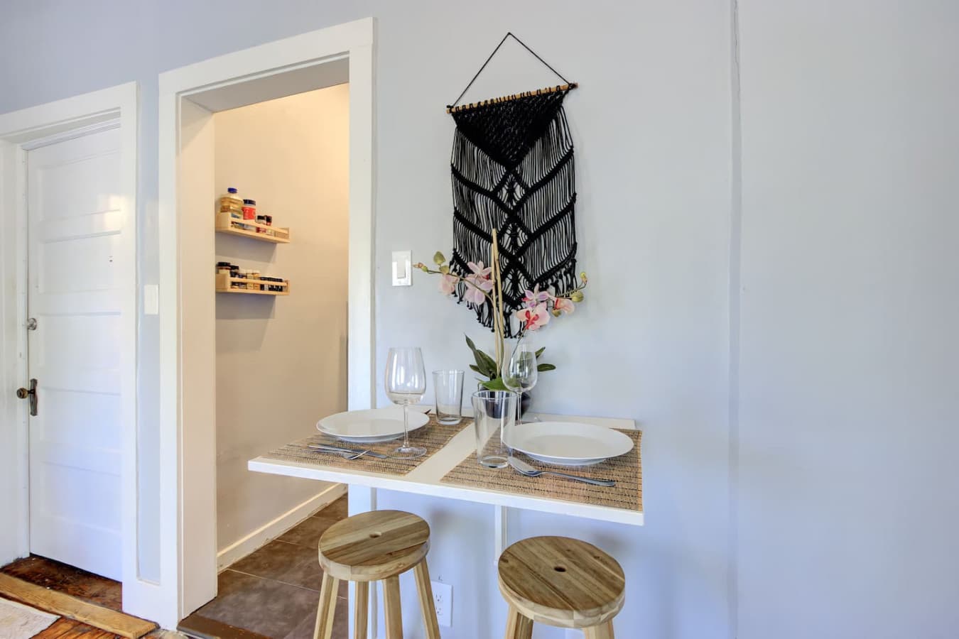 The foldable table is set for a cozy meal, with two place settings ready for use.