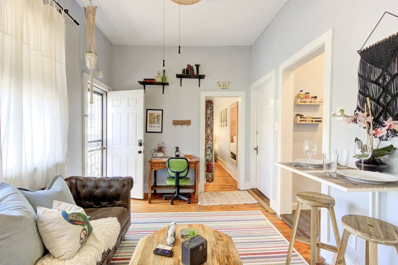 A small desk offers a perfect spot to plan your day or check in with loved ones.