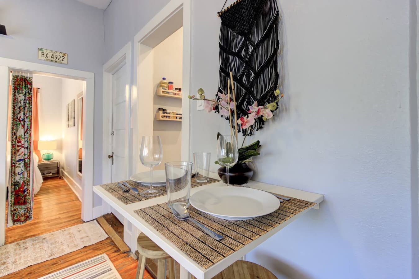 The foldable table is set for a cozy meal, with two place settings ready for use.