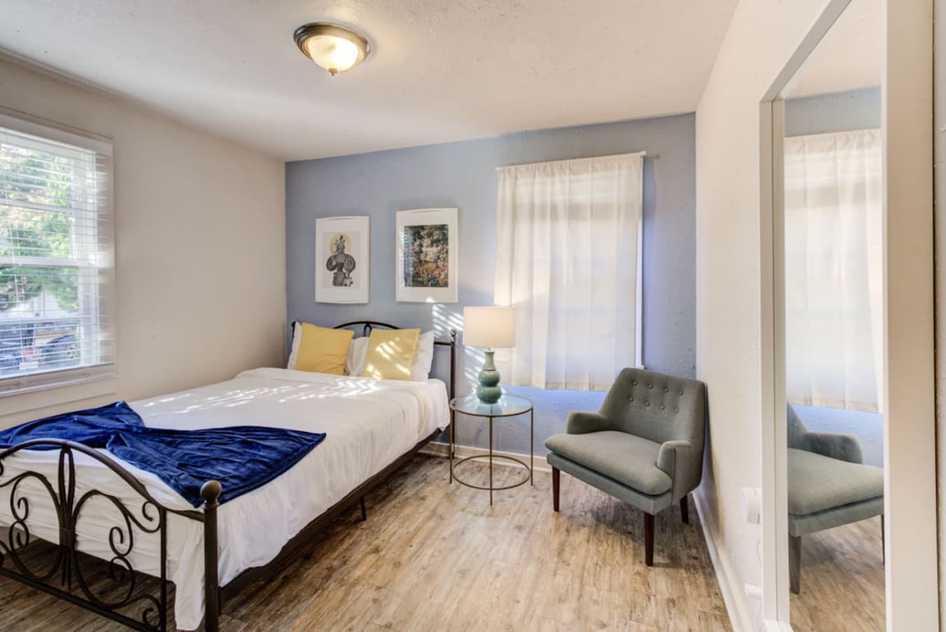 Soft linens, warm light, and a queen bed made for comfort.
