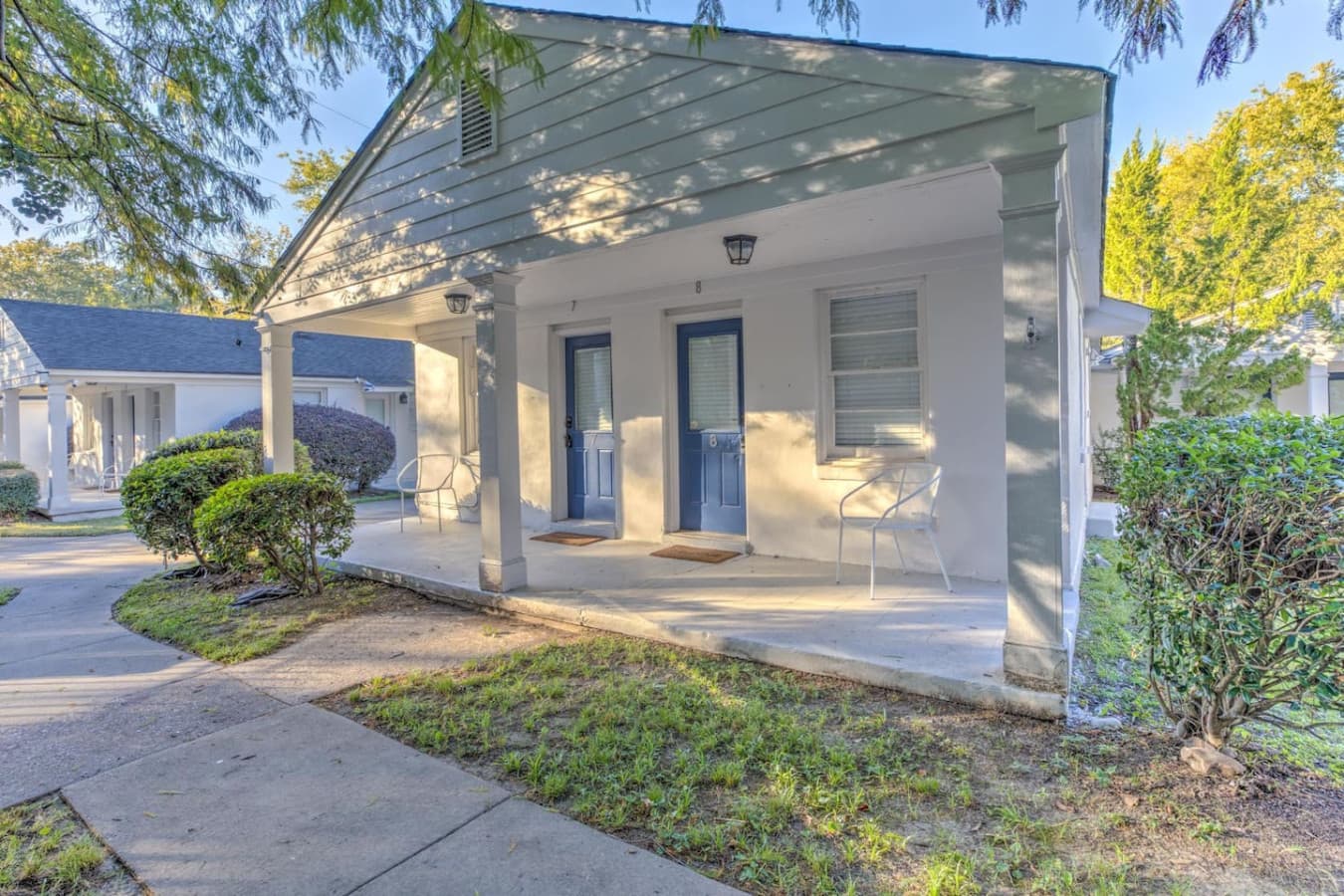 Classic Memphis charm—white cottage, blue door, and a whole lot of character.