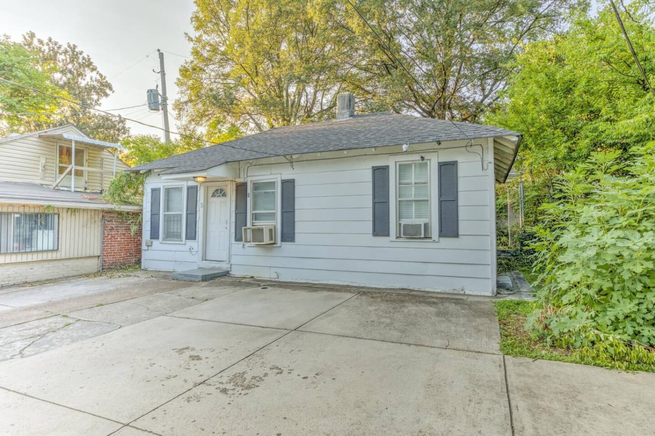 Outside view of the home. Your dedicated parking space is on the left side just right next to the fence.