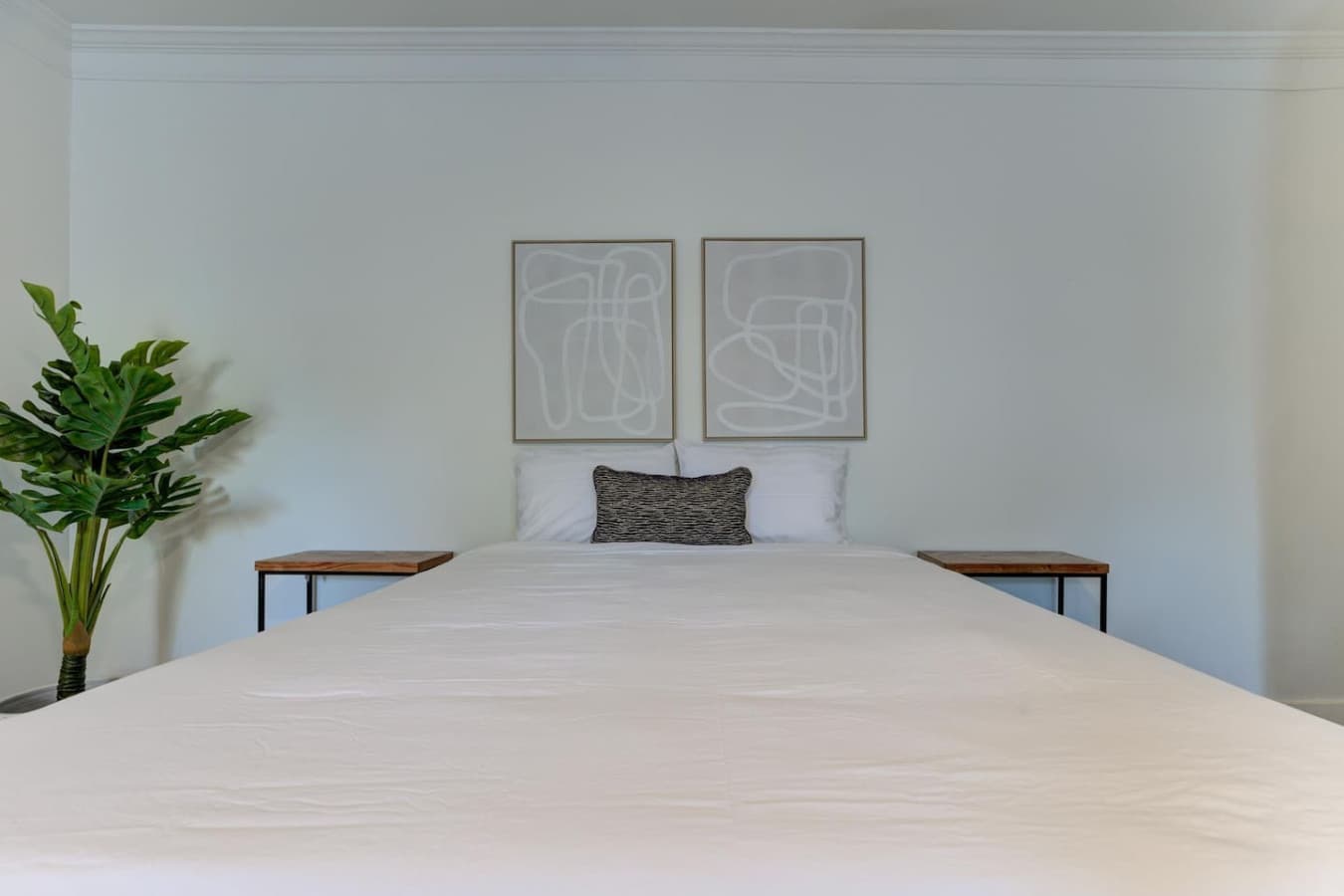 Relax and recharge on this brand new comfortable bed with nice framed art on your overhead.